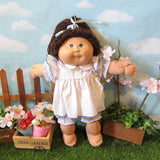 Cabbage Patch Kids doll - brown hair, brown eyes, blue dress