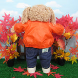 Cabbage Patch Kids girl doll with orange jacket, jeans, and tennis shoes