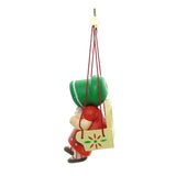 Girl in swing with green bonnet, red dress and white cat ornament