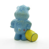 Care Bears Grumpy Bear spilling a colorful rainbow miniature figurine