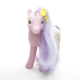 Spring Song My Little Pony with purple body and hair, yellow earring