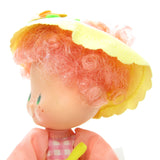 Peach Blush Strawberry Shortcake doll with green mark on face