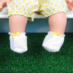 White baby doll booties with yellow bow