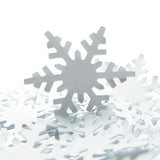 White paper punched alpine snowflakes