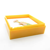 Orange plastic gift box with cracked edges